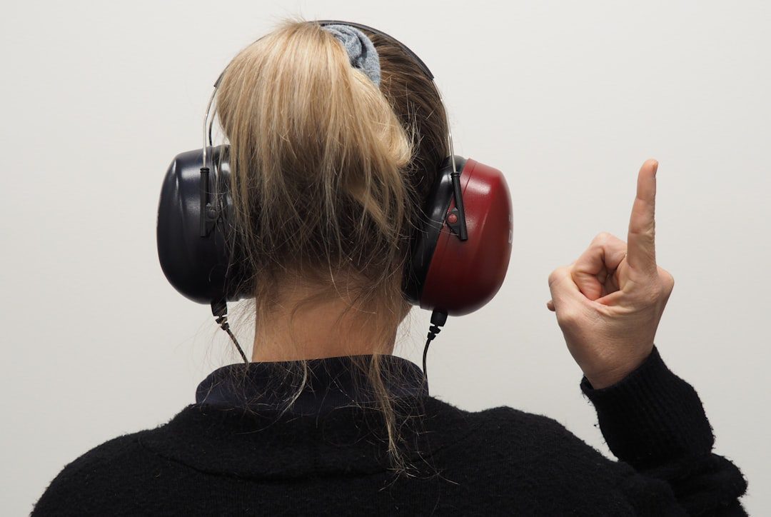 Employee completing an on-site hearing assessment with clinical headphones