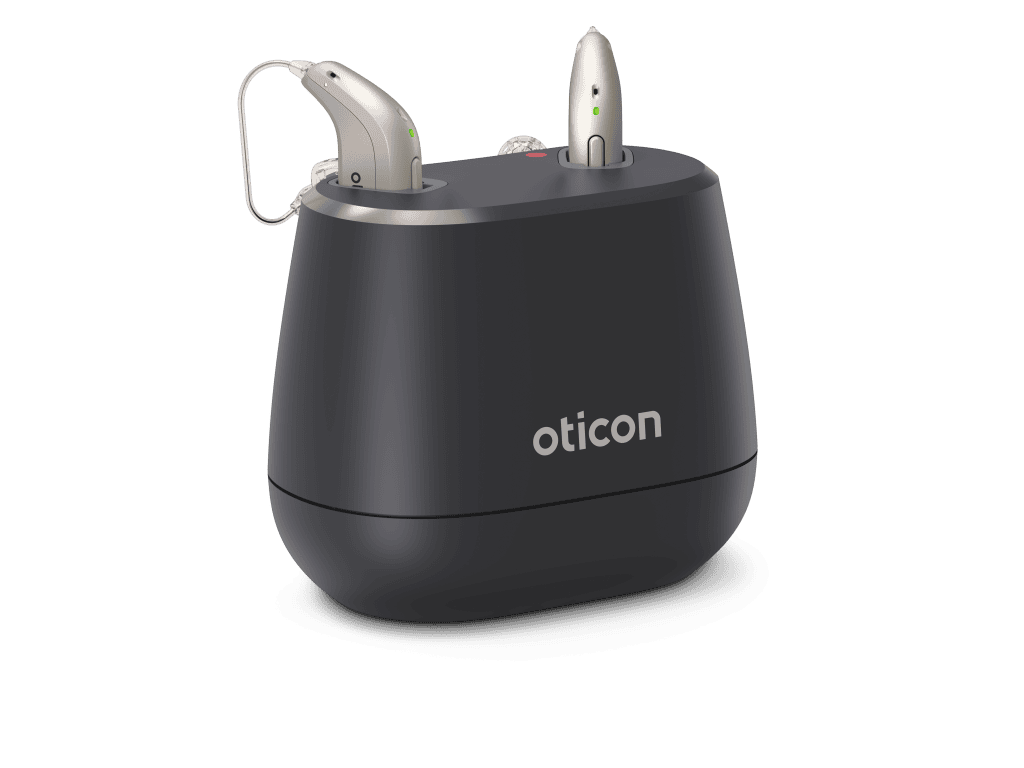Oticon Intent hearing aids in an angled desktop charger