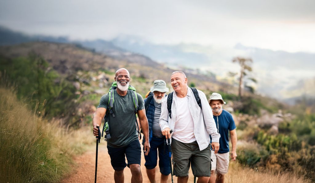 Group of older men hiking with Oticon Jet PX hearing aids
