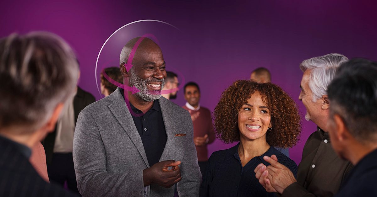 Person wearing Oticon hearing aids in a conversation setting