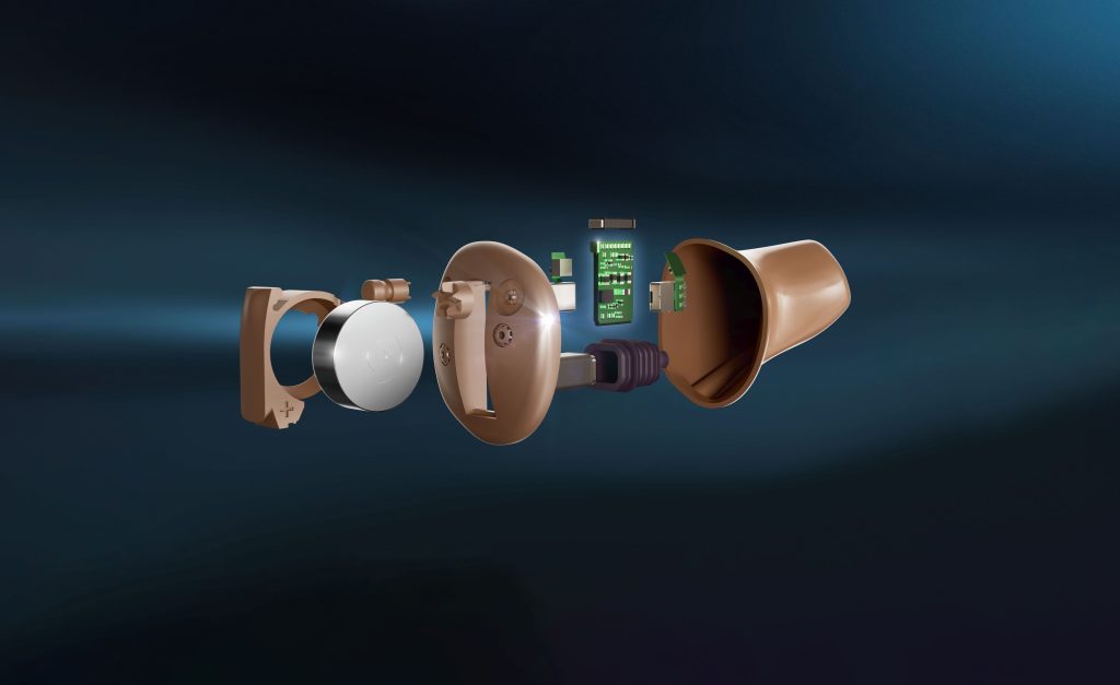 Exploded view showing the internal components of an Oticon custom hearing aid