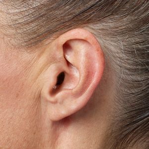 Discreet custom hearing aid worn in the ear