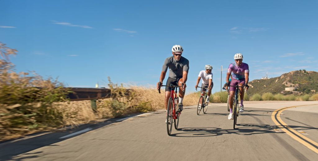 Road cyclists wearing discreet Oticon Own SI hearing aids