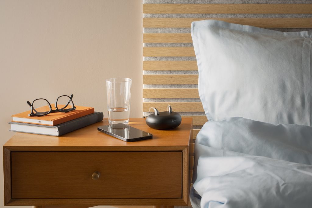 Oticon Real rechargeable hearing aids and charger