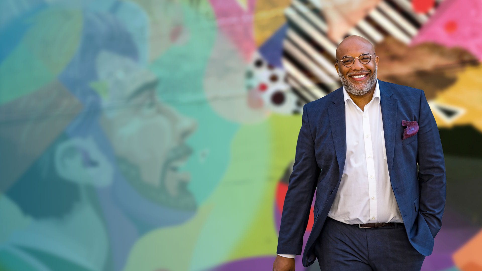 Man smiling in a lifestyle setting illustrating Signia Silk Charge&Go IX